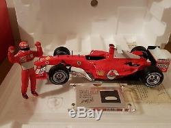 Michael Schumacher 118 Ferrari with piece of actual race suit and signed COA